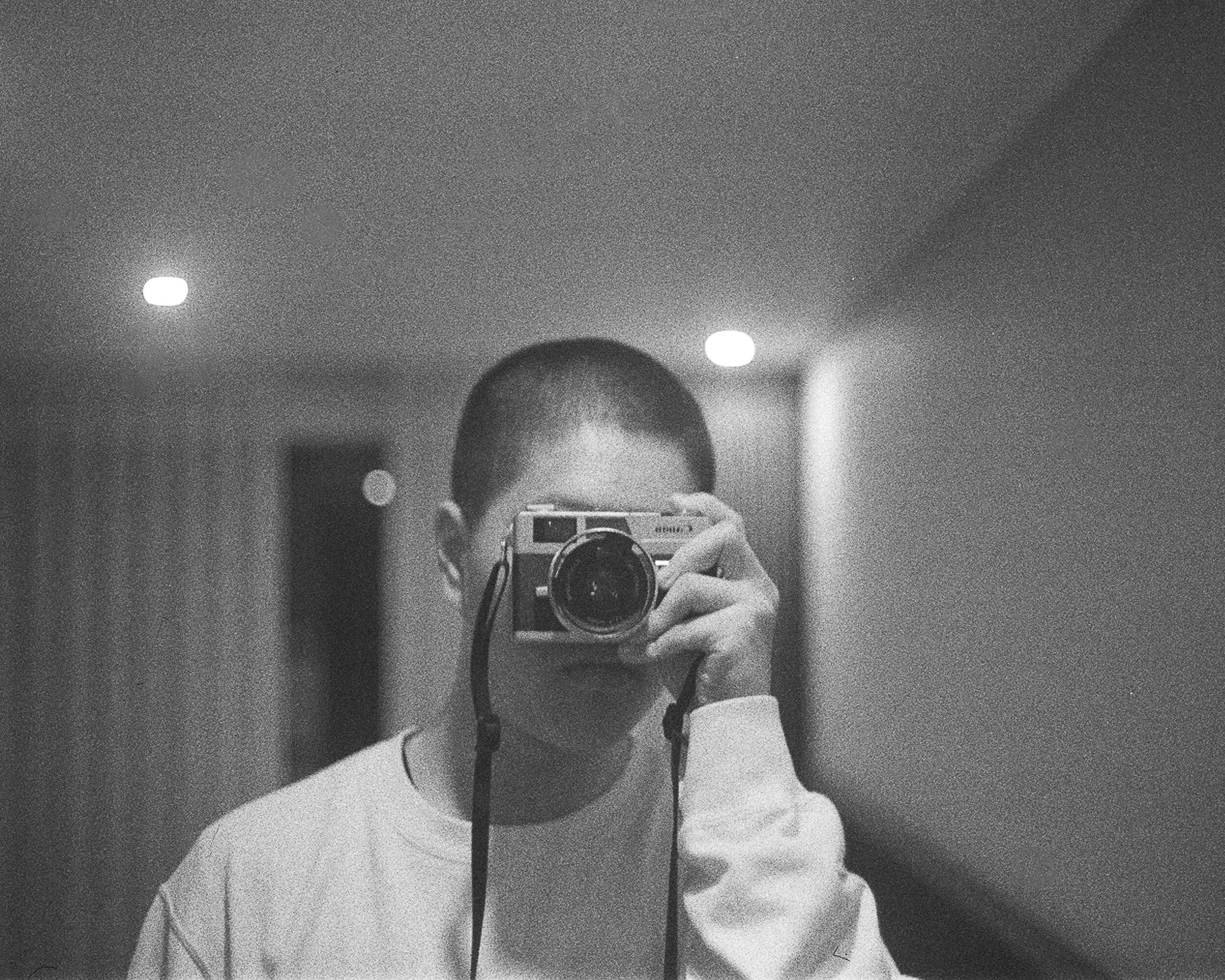 DOSTER holding a film camera